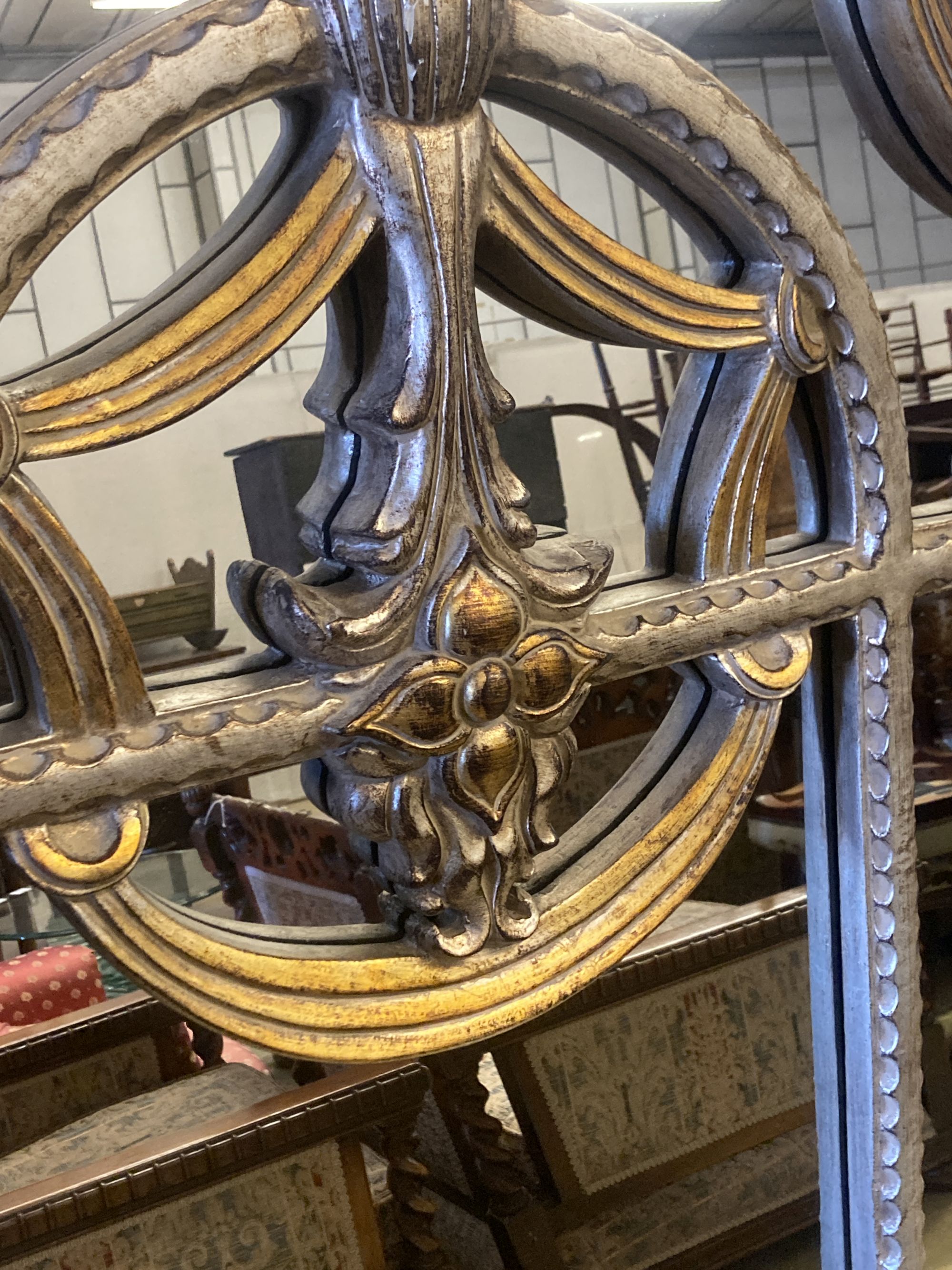 A reproduction parcel gilt arched top wall mirror, width 120cm, height 180cm